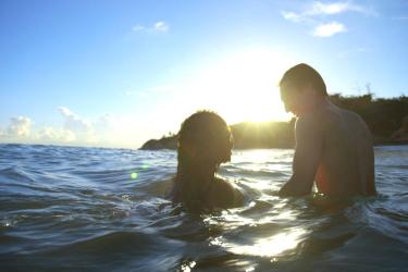 Image of two people in the ocean