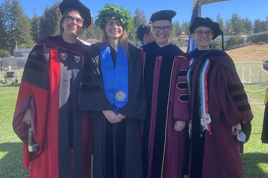 Left to right: Katherine Isbister, Alessia Cecchet, Shelley Stamp, and Susana Ruiz prepare for the PhD hooding ceremony.  Alessia was one of eight PhD graduates this year.